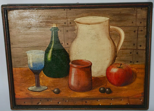 Still life of a glass, pitcher, bottle, apple and capulis on table